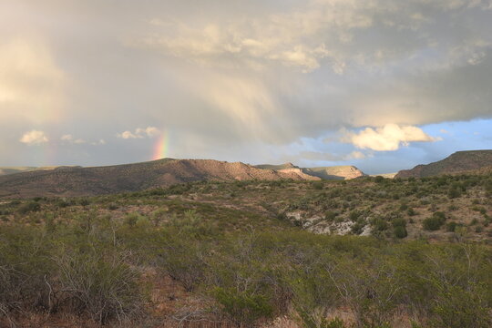 A beautiful rainbow over the desert landscape, Coconino National Forest, Yavapai County, Arizona.