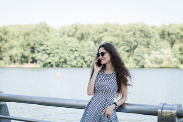 A beautiful Russian girl walks in the city park