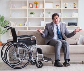 Dsabled businessman on wheelchair working home