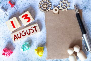 August 13th. Image of august 13 wooden color calendar on blue background. Summer day