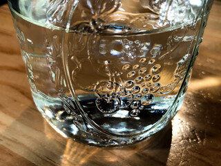 A glass cup with clear water in it