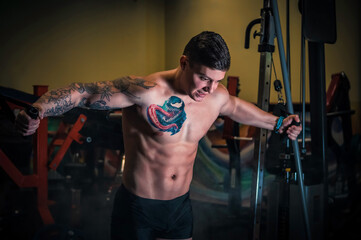 boy does sports in a fitness club