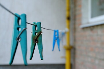 close-up of blue clothespin with rusted metal clip