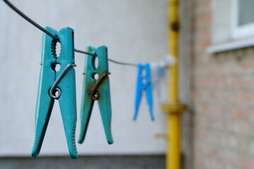 close-up of blue clothespin with metal clip
