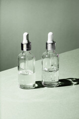 Dropper glass Bottle Mock-Up. Body treatment and spa. Natural beauty products. Eco cream, serum, skin care blank bottle. Anti-cellulite massage oil. Oily cosmetic pipette