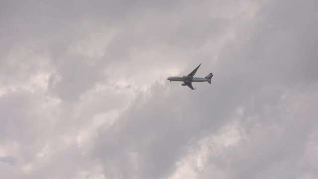 Japanese airplane flying over cloudy sky, Tottori Japan