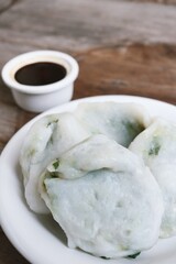 Steam dumplings chives Chinese food on wood table background