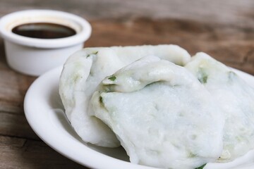 Steam dumplings chives Chinese food on wood table background
