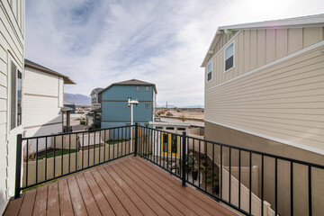 View of neighbors' houses and mountain on a balcony of a house