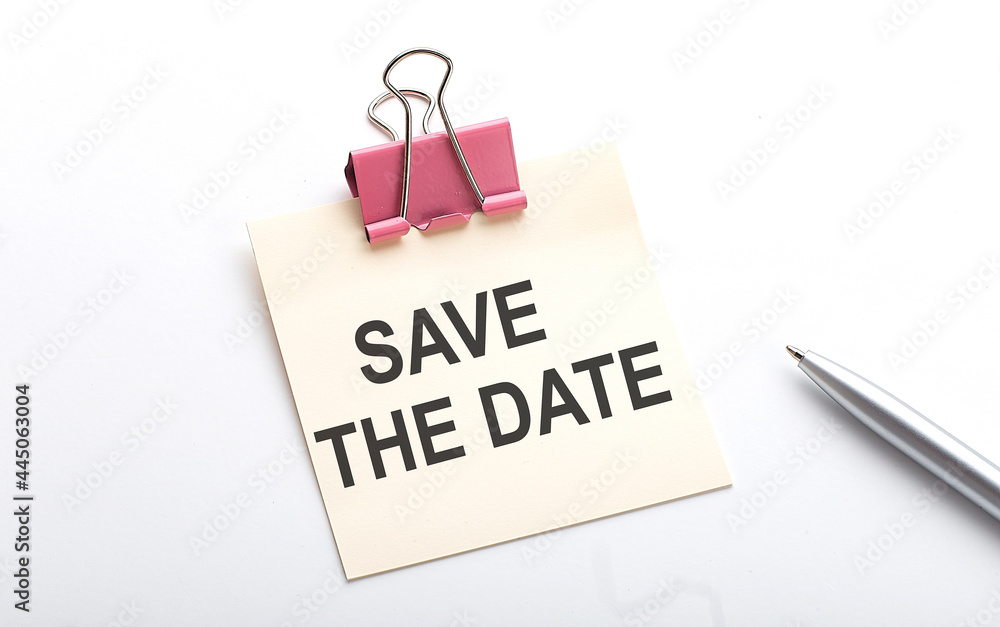Poster save the date text on sticker with pen on the white background