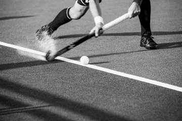 Close-up on a professional field hockey player.