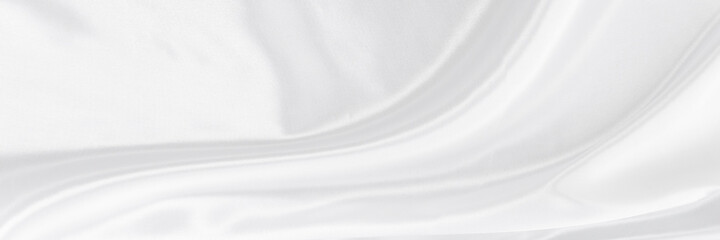 White gray satin texture that is white silver fabric silk panorama background with beautiful soft blur pattern natural.