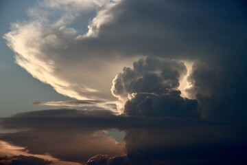 Cumulonimbus clouds illuminated by the setting sun