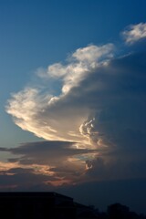 Cumulonimbus clouds illuminated by the setting sun