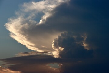 Cumulonimbus clouds illuminated by the setting sun