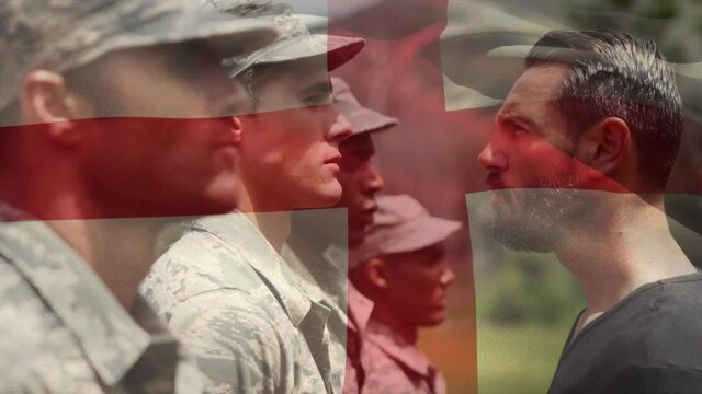 Waving england flag against army sergeant screaming in anger on a soldier at training camp