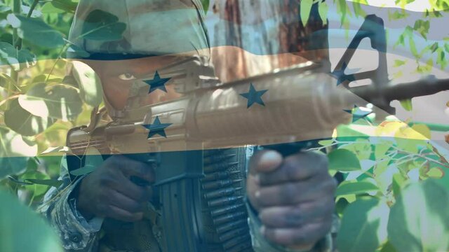 Digital composition of waving honduras flag against soldier training with a gun at training camp
