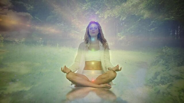 Animation of glowing light over woman practicing yoga against trees in background