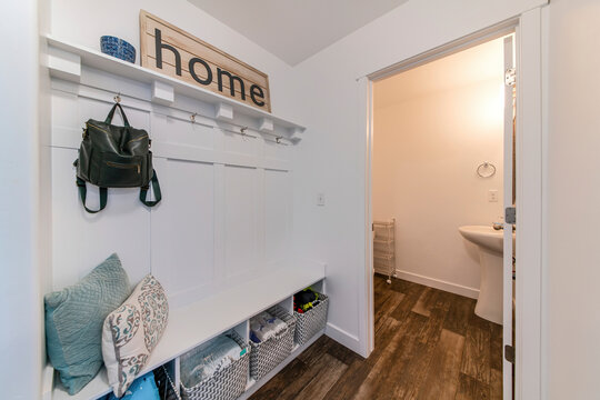 Mudroom Interior With A View Of A Sink On The Other Room