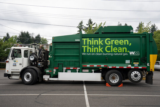 Portland, OR, USA - June 30, 2021: A WM garbage truck is seen in a parking lot in Portland, Oregon. Waste Management, Inc. (WM) is a comprehensive waste management company in North America.