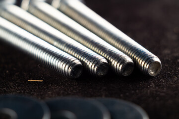 Close-up photo of a set of fasteners on a black surface