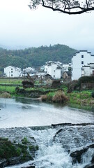 Fototapeta premium The beautiful old village view with the old buildings and natural environment in the countryside of the south China