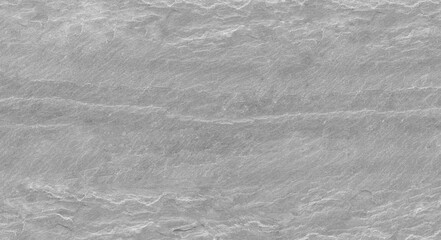 Dark grey texture of the stone wall. Close-up. Light gray rock backdrop