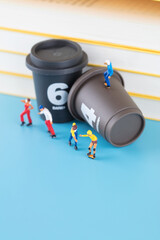 Miniature world roller skater and coffee cup