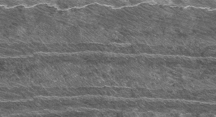 Panorama dark gray stone background with copy space. Black grunge banner with rock texture. Rock background with cracked surface.