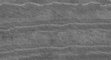 dark gray stone background with copy space. Black grunge banner with rock texture. Rock background with cracked surface.