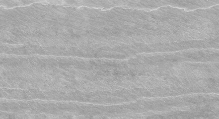 Abstract stone background. The texture of the stone wall. Close-up. Light gray rock backdrop