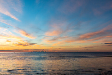 Silhouette at the hun hin beach of thailand on early morning in summer, Beautiful sunset over the sea.