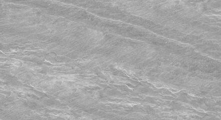 Abstract stone background. The texture of the stone wall. Close-up. Light gray rock backdrop