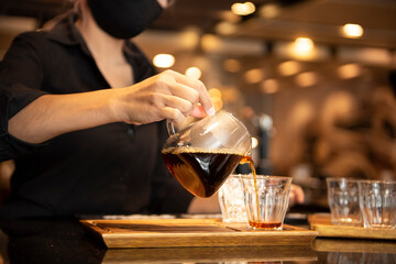 Professional barista preparing coffee alternative method