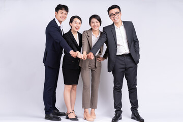 Group of Asian business people posing on a white background