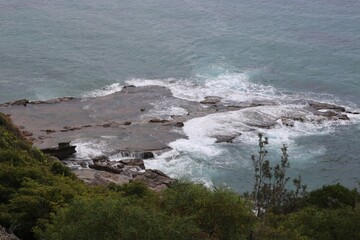 waves crashing on rocks