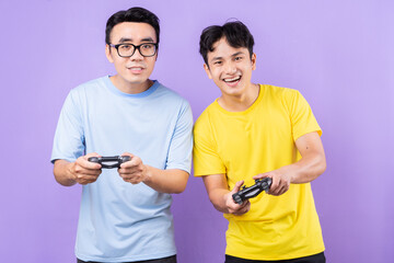 Two Asian brothers playing games together