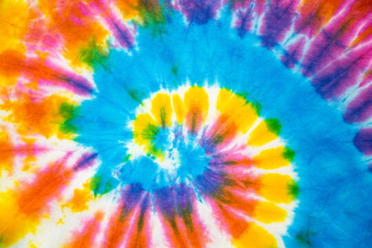 abstract rainbow spiral tie dye background. © Rattanachai