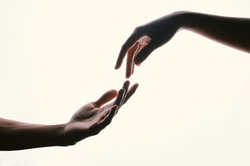 Giving a helping hand, hope, and support to each other over white background.