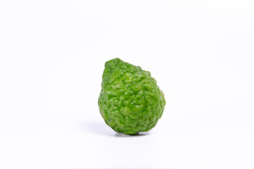 fresh green kaffir lime laying on a clean white background