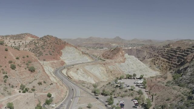 Aerial view of a road leading to the Copper Queen Mine near Bisbee Arizona. The rock is colorful and layered with sediment textures. 
