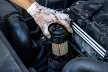 replacing the oil filter on the car.