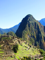 Fototapeta na wymiar Explorando las Ruinas de Machu Picchu, Maravilla del Mundo, Perú.