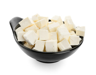 Bowl with pieces of feta cheese on white background