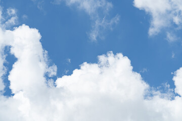 Blue sky with beautiful natural white clouds. Space for text. Background.