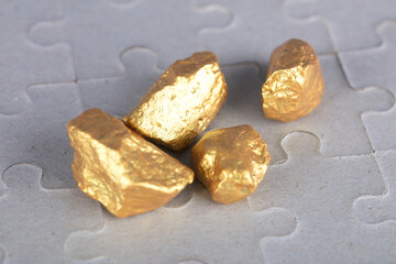 Broken gold hard currency on the mosaic