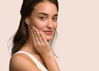 Fototapeta premium Beauty woman face natural make up healthy skin over color background