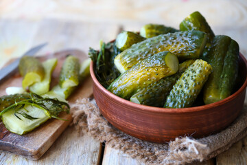 Salted cucumbers in a bowl. Fermented cucumbers. Probiotics.