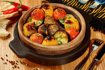 Tandoor baked vegetables in wooden bowl with shotis puri
