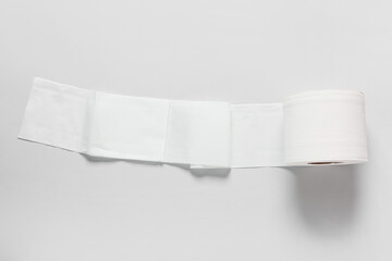 Roll of toilet paper on grey background